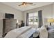 Bedroom features a large window, a TV atop drawers, and desk area at 247 Verdant Dr, Cicero, IN 46034
