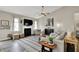 Inviting living room with a fireplace, large windows, and comfortable seating arrangements at 247 Verdant Dr, Cicero, IN 46034