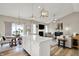 Open concept living space with island, dining area, and fireplace in the living room at 247 Verdant Dr, Cicero, IN 46034