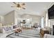 Open-concept living room with a view into the kitchen and dining area at 247 Verdant Dr, Cicero, IN 46034