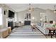 Cozy living room featuring a fireplace, vaulted ceilings, and plush seating at 247 Verdant Dr, Cicero, IN 46034