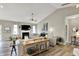 Bright and open living room featuring vaulted ceilings, a fireplace, and neutral decor at 247 Verdant Dr, Cicero, IN 46034