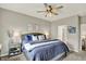 Cozy main bedroom with a ceiling fan, bedside tables, and framed artwork on the walls at 247 Verdant Dr, Cicero, IN 46034