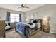 Comfortable main bedroom with a ceiling fan, a dresser, and natural light from the window at 247 Verdant Dr, Cicero, IN 46034