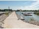 Picturesque view of a scenic walkway leading to a waterfront, with docks and boats on a sunny day at 247 Verdant Dr, Cicero, IN 46034