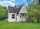 Charming cottage-style home with a quaint front porch and lush green lawn at 2606 Raible Ave, Anderson, IN 46011