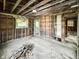 Interior image showcasing the open framework, wooden floors, and natural light at 2606 Raible Ave, Anderson, IN 46011