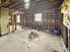 Unfinished living room with exposed framing, natural light from windows, presenting a blank canvas for your renovation ideas at 2606 Raible Ave, Anderson, IN 46011