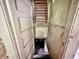 Stairwell with pull-down ladder to a basement at 2606 Raible Ave, Anderson, IN 46011