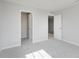 Bright bedroom showcases neutral walls, plush carpet, and a closet for optimal storage options at 2693 Penn Ave, Plainfield, IN 46168