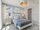 Bedroom with light blue paint scheme, white trim, carpet, and large windows at 2693 Penn Ave, Plainfield, IN 46168