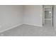 A bedroom features neutral walls, plush carpet, and an open door that leads to other rooms at 2693 Penn Ave, Plainfield, IN 46168
