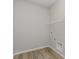 Walk-in closet with wood-look flooring, wire shelving and washer-dryer hookups at 2693 Penn Ave, Plainfield, IN 46168