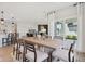 Bright dining room with a large window, and open to the kitchen and living area at 2693 Penn Ave, Plainfield, IN 46168