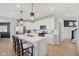 Bright kitchen featuring white cabinets, stainless steel appliances, and a large island with bar seating at 2693 Penn Ave, Plainfield, IN 46168