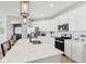 Bright kitchen featuring white cabinets, stainless steel appliances, and a large island with bar seating at 2693 Penn Ave, Plainfield, IN 46168