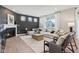 Stylish living room featuring a fireplace, large sectional sofa, and ample natural light at 2693 Penn Ave, Plainfield, IN 46168