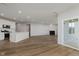 Open concept living space with a kitchen, living room with fireplace, and dining area at 2693 Penn Ave, Plainfield, IN 46168
