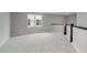 Spacious loft area with neutral carpet and natural light at 2693 Penn Ave, Plainfield, IN 46168