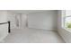Open loft area with gray carpet, natural light and access to a hallway at 2693 Penn Ave, Plainfield, IN 46168