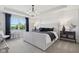Elegant main bedroom featuring a large window, tray ceiling, and sophisticated decor at 2693 Penn Ave, Plainfield, IN 46168