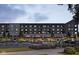 View of the building's parking area and bustling commercial spaces, highlighting community and convenient access at 2693 Penn Ave, Plainfield, IN 46168