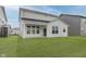 Spacious backyard features a well-maintained lawn and covered patio, perfect for outdoor enjoyment at 2705 Penn Ave, Plainfield, IN 46168