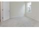 Bright bedroom featuring neutral walls and carpet, and an exterior window at 2705 Penn Ave, Plainfield, IN 46168