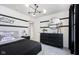 Stylish bedroom with modern lighting, contrasting black and white stripes, and sleek furnishings, creating a contemporary aesthetic at 2705 Penn Ave, Plainfield, IN 46168