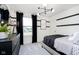 Modern bedroom with black accents, a large window with backyard views, and contemporary furnishings, offering a serene retreat at 2705 Penn Ave, Plainfield, IN 46168