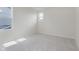 Bright bedroom features neutral carpet and paint, and a view of the roofline at 2705 Penn Ave, Plainfield, IN 46168