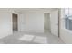 Bright bedroom with neutral carpet and paint features an open closet at 2705 Penn Ave, Plainfield, IN 46168