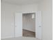 Spacious bedroom featuring plush carpeting, a view into the en-suite, and crisp white trim at 2705 Penn Ave, Plainfield, IN 46168