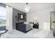 Chic bedroom featuring a gray accent wall, stylish lighting, and a cozy bed, creating a modern and inviting space at 2705 Penn Ave, Plainfield, IN 46168