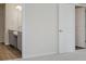Neutral bedroom featuring a pass through to the ensuite bathroom and an open door at 2705 Penn Ave, Plainfield, IN 46168