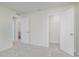 Bright bedroom features neutral walls and carpet with a view to the ensuite bathroom and closet at 2705 Penn Ave, Plainfield, IN 46168