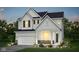 Charming two-story home featuring white siding, black shutters, stone accents, and a well-manicured lawn at 2705 Penn Ave, Plainfield, IN 46168