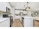 Stylish kitchen boasting stainless steel appliances, white countertops, and an island perfect for entertaining at 2705 Penn Ave, Plainfield, IN 46168
