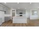 Modern kitchen boasts gray cabinets, a center island, and stainless steel appliances at 2705 Penn Ave, Plainfield, IN 46168