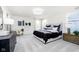 Bright main bedroom featuring modern furnishings, neutral tones, and ample natural light at 2705 Penn Ave, Plainfield, IN 46168