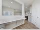 Bright open workspace offers neutral walls, hardwood floors, and natural lighting at 2705 Penn Ave, Plainfield, IN 46168
