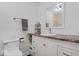 Bright bathroom with white vanity, granite countertop, and tiled shower with glass door at 305 N 1100 E, Zionsville, IN 46077