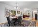Charming dining area featuring natural light and an elegant chandelier at 305 N 1100 E, Zionsville, IN 46077