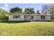 Charming single-story home featuring a well-maintained lawn and inviting facade at 305 N 1100 E, Zionsville, IN 46077