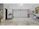 Spacious garage with ample lighting, and built in storage shelving for organization at 305 N 1100 E, Zionsville, IN 46077