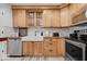 Charming kitchen with wooden cabinets, farmhouse sink, stainless steel appliances and white subway tile backsplash at 305 N 1100 E, Zionsville, IN 46077