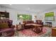 Bright and airy living room with a stylish rug, comfortable seating, and natural light at 305 N 1100 E, Zionsville, IN 46077