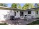 Outdoor patio featuring multiple seating arrangements, a grill, and a neatly paved surface perfect for entertaining at 305 N 1100 E, Zionsville, IN 46077