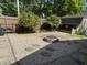 Backyard featuring gravel, a fire pit, stepping stones, flower bushes, and a shed at 309 Arlington Dr, Whiteland, IN 46184