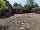 Spacious backyard with gravel, stepping stones, and a patio with outdoor seating at 309 Arlington Dr, Whiteland, IN 46184